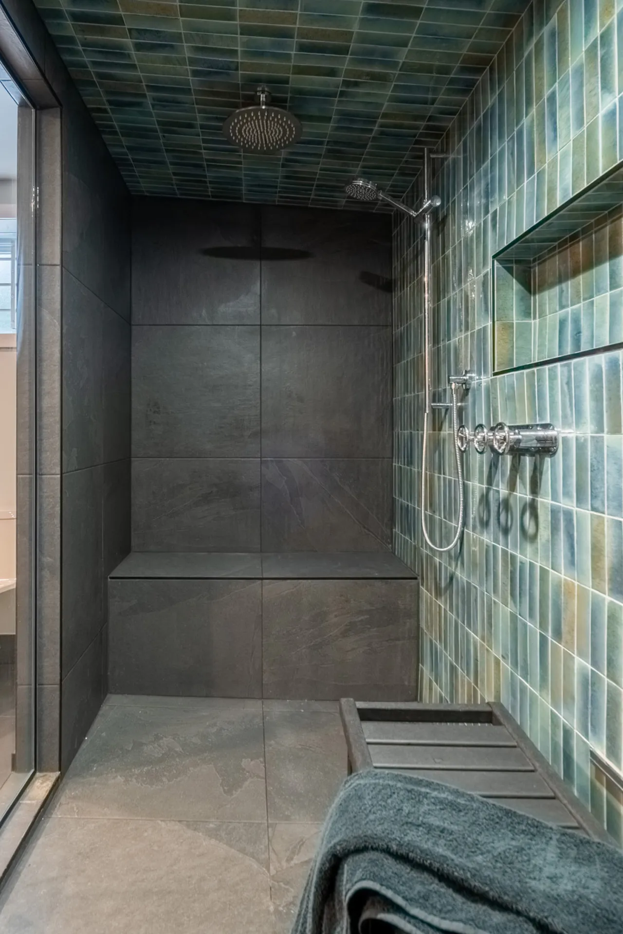 Modern Menuitech shower Lemay Laval project: black tile, green backsplash, chrome fixtures, rainfall showerhead