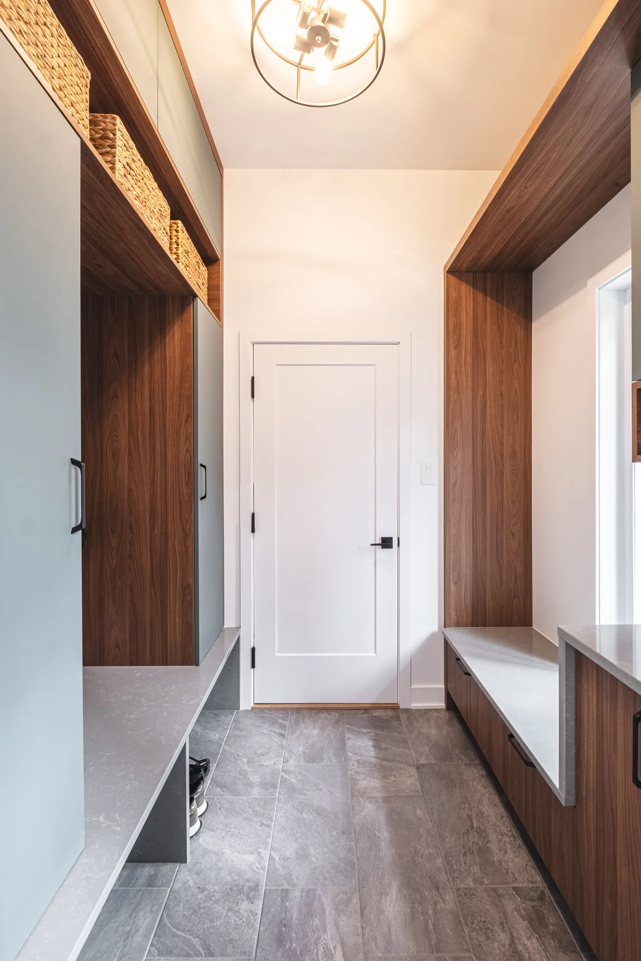 Diard bathroom: dark stained wood cabinets, grey countertops, double sink vanity, pendant lighting